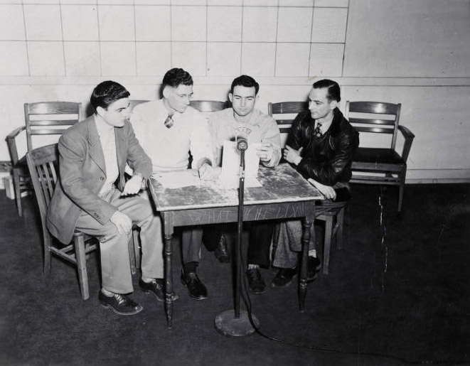 1948—Four announcers read news for KWSC