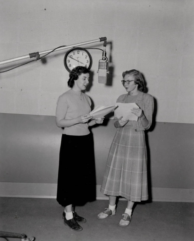 1950—Students practice lines on the KWSC radio microphone